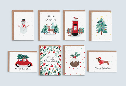 8 different Christmas cards on a blue background. 8 designs include a snowman, reindeer, letterbox, christmas tree, red car, hollies, christmas pudding and a christmas sausage dog with a hat. 